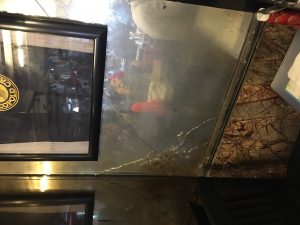 A bullet hole preserved in the wall of the Leopold Café